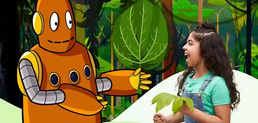 Moby and a child hold leaves