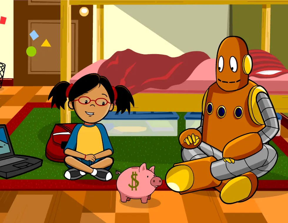 Annie and Moby sit on the floor with a piggy bank
