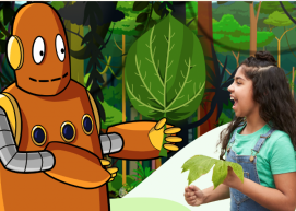 Moby hands a leaf to a girl in a forest.