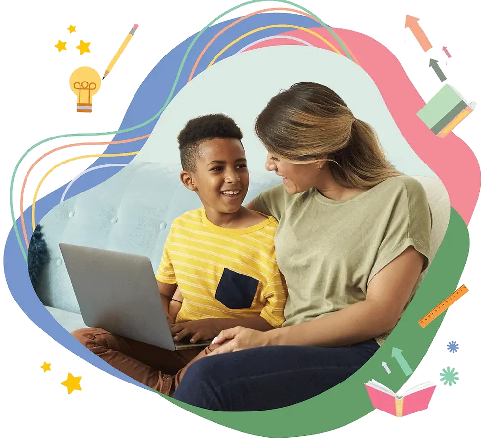 Mother and son sit on a couch and smile in front of a computer