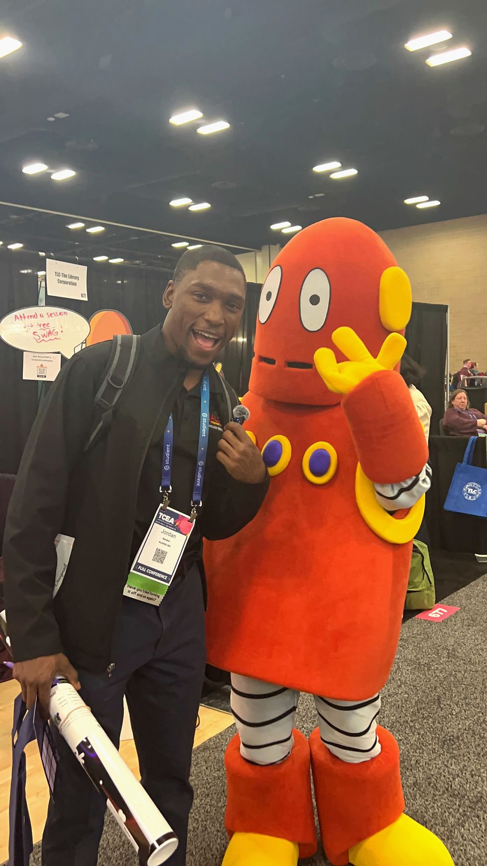 Lifesize Moby mascot posing with a teacher at an event