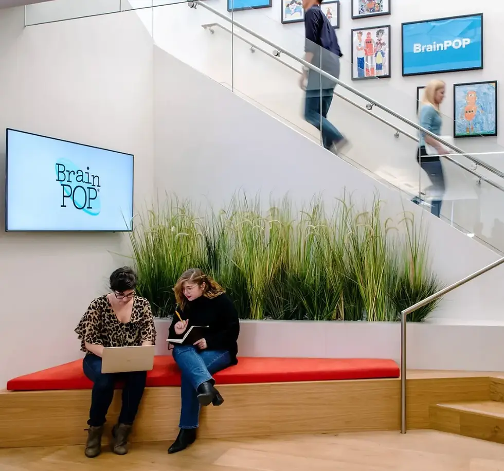BrainPOP Flatiron NYC office. Artwork around the stairs depict student drawings of Moby. 