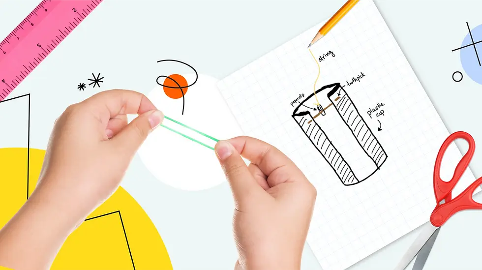 Hands stretch a green rubber band over a graph paper with a cup sketch. Red scissors, pink ruler, and patterns in the background.