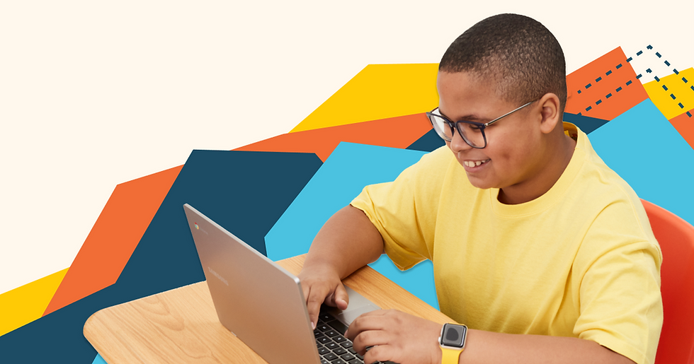 Boy in a yellow shirt smiling and typing on a laptop at a desk. Colorful geometric background adds a playful mood.