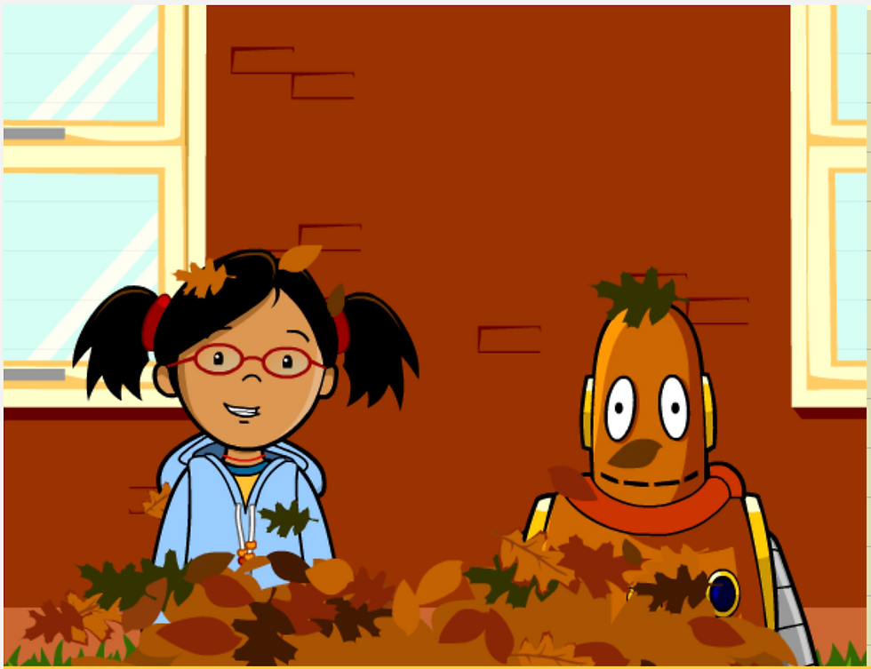 BrainPOP Jr. Fall topic: Annie and Moby standing in a pile of autumn leaves indoors near a window.