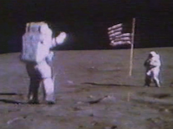 Astronaut jumping in space next to the American flag